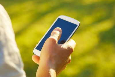 Close-up of person using mobile phone