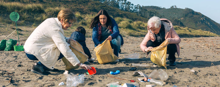Group of people relaxing on land
