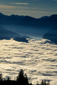 Scenic view of silhouette mountains against sky during sunset