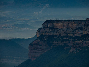 Scenic view of rock formations against sky