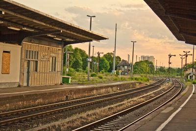 Train at railroad station against sky