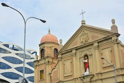 Low angle view of traditional building against sky in city