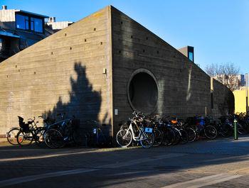 Bicycle against building in city