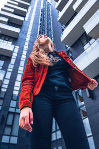 Low angle view of woman looking away