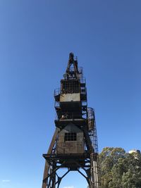 Low angle view of tower against clear blue sky