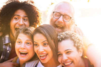 Portrait of smiling friends at home