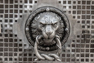 Close-up of statue against wall