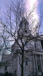 Low angle view of bare trees against the sky