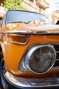 Close-up of orange vintage car