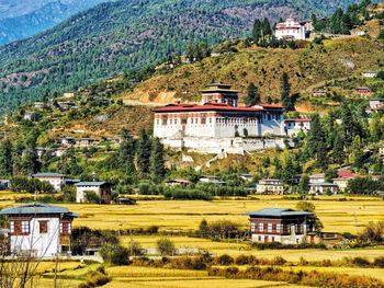 Scenic view of buildings against mountain