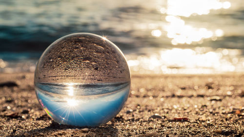 Close-up of crystal ball on field