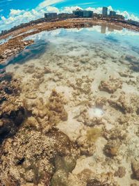 Scenic view of sea against cloudy sky
