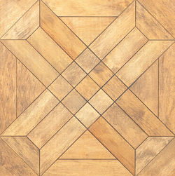 Natural wood surface with geometric abstract centered pattern. closeup.