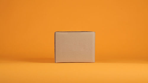 Blank adhesive note on yellow background