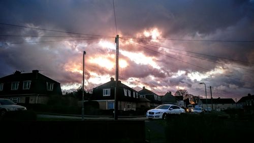 Built structures against cloudy sky