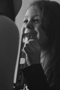 Close-up portrait of girl looking down