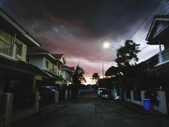 Street amidst buildings in city against sky