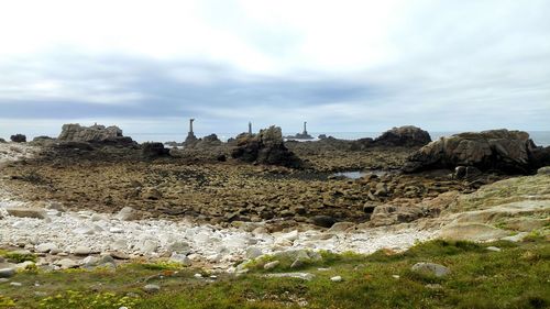 Rocks on shore against sky