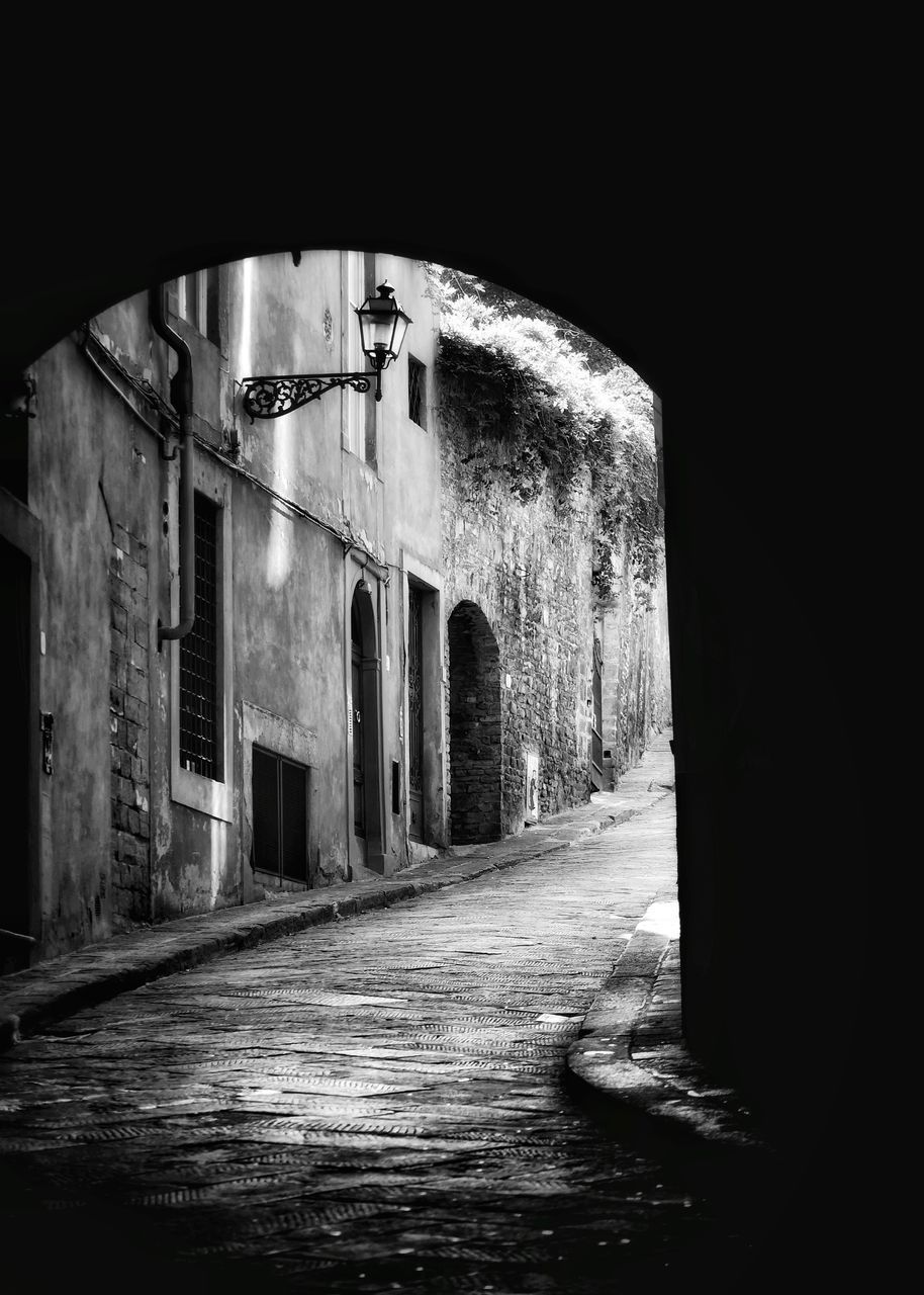 VIEW OF BUILDING THROUGH ARCHWAY