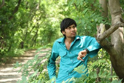 Portrait of a young man in forest
