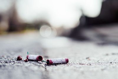 Close-up of abandoned firework on road