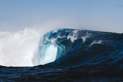 Scenic view of sea waves against clear sky