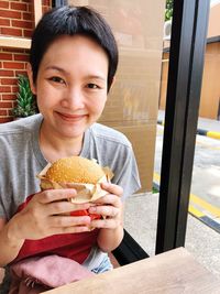 Portrait of smiling boy eating food