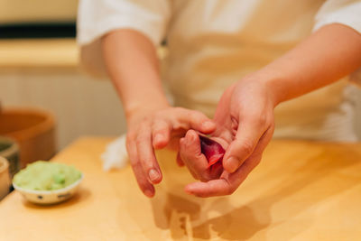 Midsection of woman preparing food