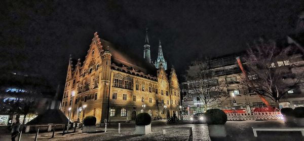 Illuminated buildings in city at night