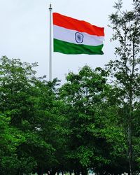 Low angle view of flag against sky