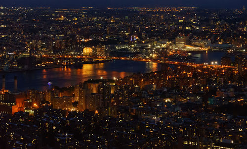 Aerial view of city lit up at night