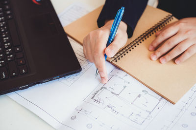 High angle view of woman working on table