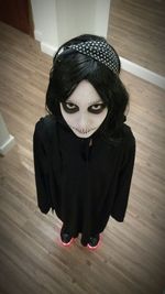 Portrait of man wearing sunglasses at home