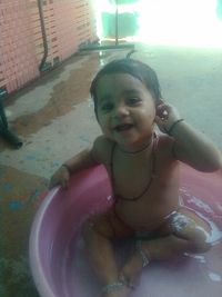 Portrait of smiling boy in swimming pool