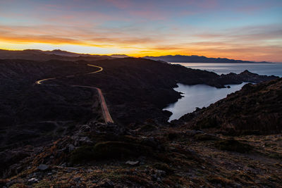 High angle view of land against sky during sunset