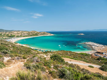 High angle view of bay against clear blue sky