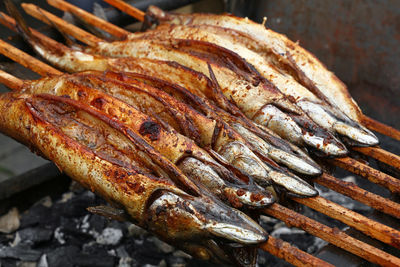 Close-up of fish on barbecue grill