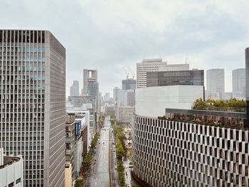 Buildings in city against sky