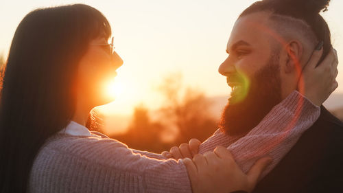 Lovely couple at sunset light