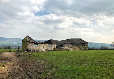 House on field against sky