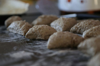 Close-up of raw buns on table