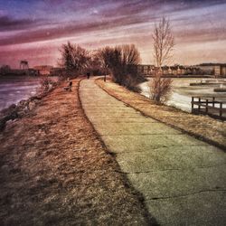 Scenic view of river at sunset