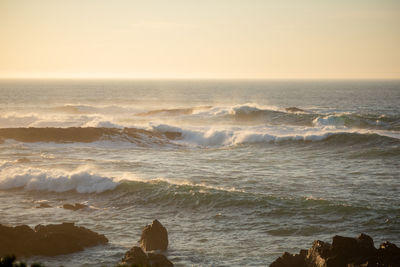 Scenic view of sea against sky during sunset