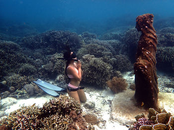 Woman swimming in sea