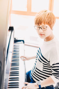 Boy sitting at piano