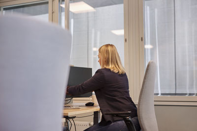 Woman sitting at desk in office