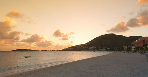 Scenic view of beach against sky during sunset