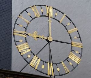 Close-up of clock on wall