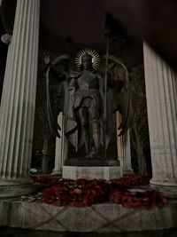 Low angle view of statue against building