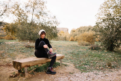 Portrait of man sitting on bench